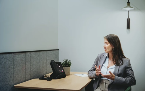 A Woman Using An AudioCodes C470HD IP Phone 6